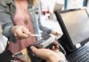 Shopper paying with contactless card