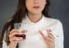 young woman with glass and cigarette