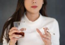 young woman with glass and cigarette