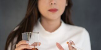 young woman with glass and cigarette