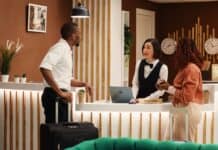 Tourism sector, receptionist at work, source: Shuttterstock