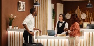 Tourism sector, receptionist at work, source: Shuttterstock