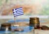 greek flag and coins on map, source: Shutterstock