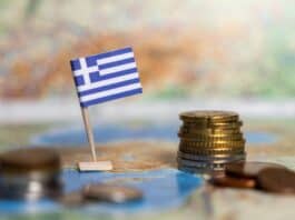 greek flag and coins on map, source: Shutterstock