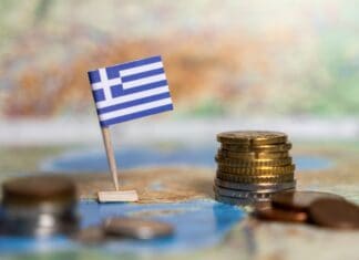 greek flag and coins on map, source: Shutterstock