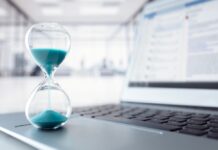 hourglass on laptop, time is money visualization, source: Shutterstock