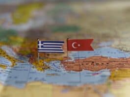 Greece-Turkey flags on map, source: Shutterstock