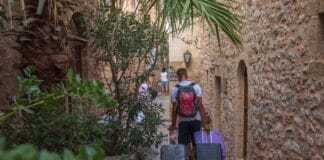 Tourist with suitcases arrives in Monamvasia, source: Shutterstock