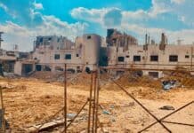 Gaza building and fence, source: Gaza - Survival Journey / Shutterstock.com